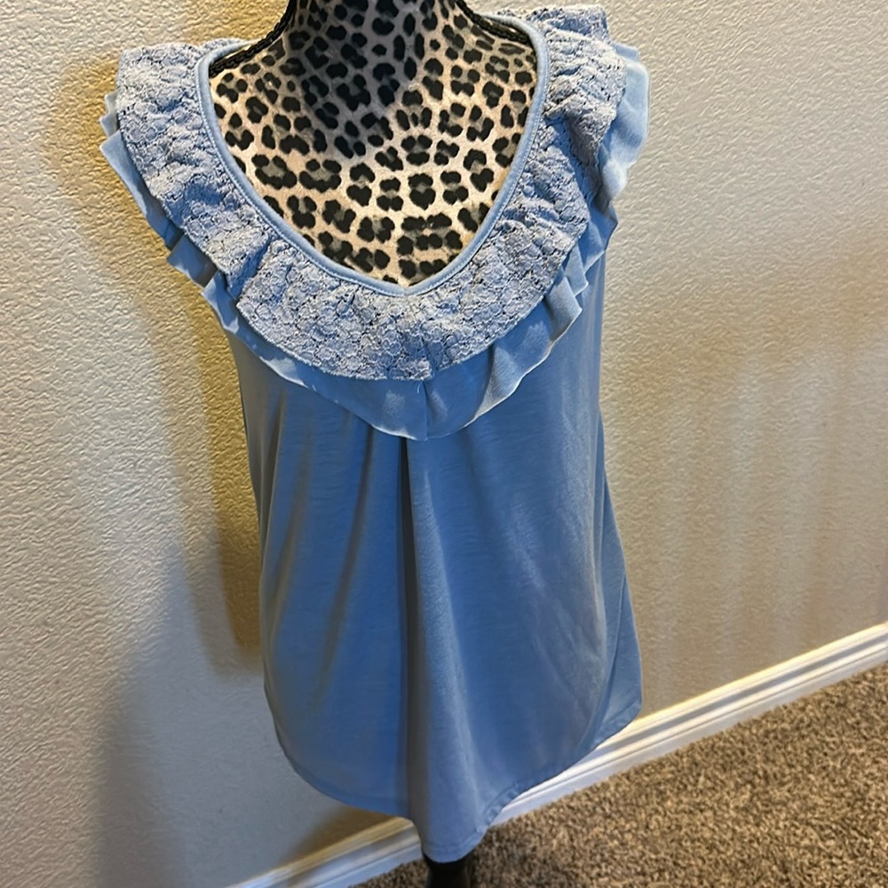 Women’s sleeveless top, baby blue color, ruffle/lace detail, no size tag, size M